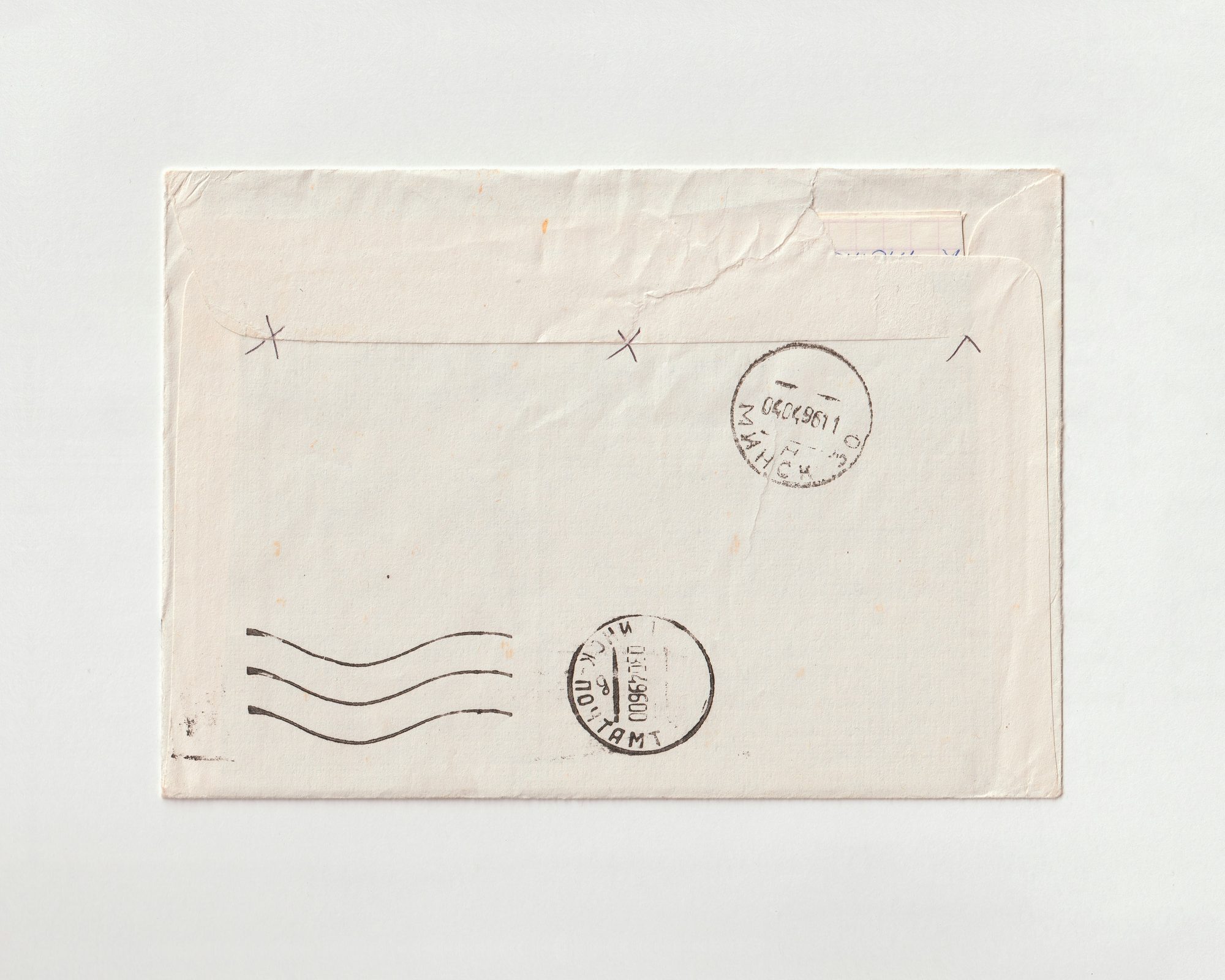 A vintage hand-stamped postal envelope